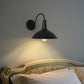 YANSUN Wall Sconce with Curved Arm & Round Backplate, Matte Black Finish, Minimalist Design, Traditional Single-Light