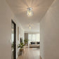 YANSUN 7.1 in. 1-Light Semi Flush Mount Ceiling Light, Triangular Crystal, Matte Black Cross Metal Shade, Chrome Finish, E26